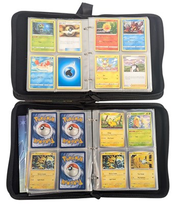 Lot 576 - POKEMON - x2 FOLDERS OF POKEMON TRADING CARDS