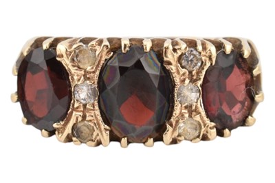 Lot 258 - HALLMARKED 9CT GOLD & GARNET THREE STONE RING