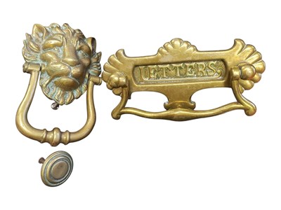 Lot 311 - TWO EARLY 20TH CENTURY VINTAGE BRASS DOOR KNOCKERS