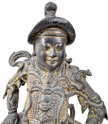 Lot 40 - QING CAST BRONZE FIGURE OF DEITY OF TAOISM 清 真武大帝铜(?)坐像