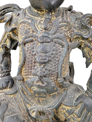 Lot 40 - QING CAST BRONZE FIGURE OF DEITY OF TAOISM 清 真武大帝铜(?)坐像
