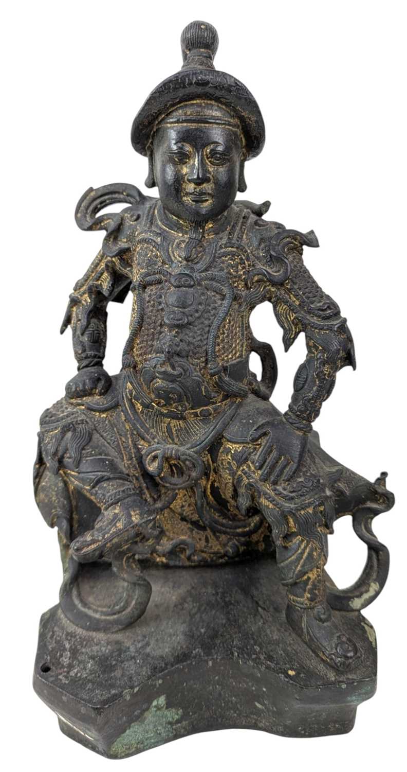 Lot 40 - QING CAST BRONZE FIGURE OF DEITY OF TAOISM 清 真武大帝铜(?)坐像