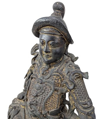 Lot 40 - QING CAST BRONZE FIGURE OF DEITY OF TAOISM 清 真武大帝铜(?)坐像