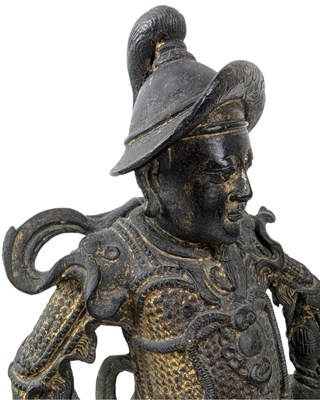 Lot 40 - QING CAST BRONZE FIGURE OF DEITY OF TAOISM 清 真武大帝铜(?)坐像