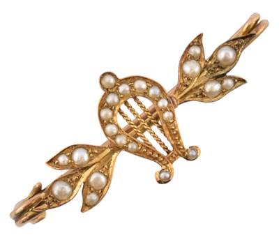 Lot 148 - EARLY 20TH CENTURY GOLD & HALF PEARL BROOCH