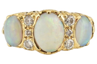 Lot 22 - HALLMARKED 18CT GOLD THREE STONE OPAL CABOCHON RING