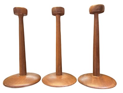 Lot 395 - THREE DANISH INSPIRED MID CENTURY TEAK WOOD CANDLESTICKS/CANDLE HOLDERS