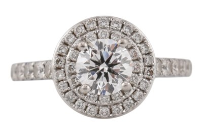 Lot 87 - 950 PLATINUM & DIAMOND HALO RING