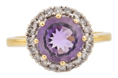 Lot 130 - 18CT GOLD AMETHYST & DIAMOND HALO RING