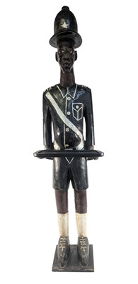 Lot 647 - WEST AFRICAN WOODEN STANDING COLON FIGURE OF A POLICEMAN