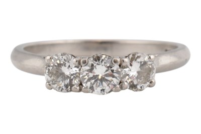 Lot 24 - 950 PLATINUM & DIAMOND THREE STONE RING