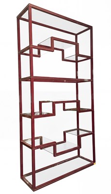 Lot 550 - PIERRE VANDEL PARIS - 1970S BURGUNDY AND GILT METAL BOOKCASE