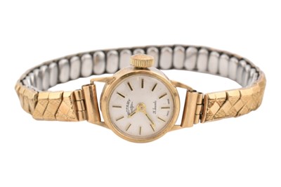 Lot 84 - HALLMARKED 9CT GOLD ROTARY LADIES WRISTWATCH ON PLATED STRAP
