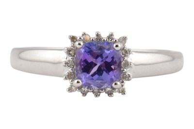 Lot 133 - HALLMARKED 18CT GOLD TANZANITE & DIAMOND HALO RING