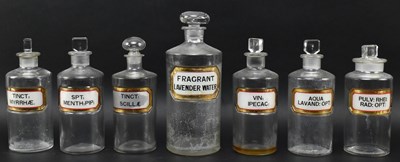 Lot 244 - SEVEN VINTAGE 20TH CENTURY GLASS APOTHECARY / CHEMISTS BOTTLES WITH LABELS