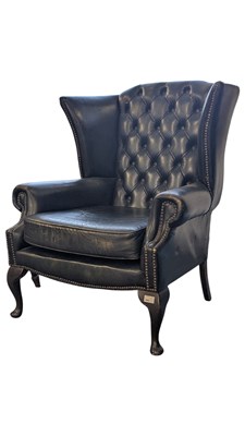 Lot 864 - EARLY 20TH CENTURY GREEN LEATHER WINGBACK ARMCHAIR