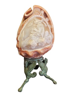 Lot 232 - 20TH CENTURY VINTAGE CARVED CONCH ON A METAL TRIPOD BASE