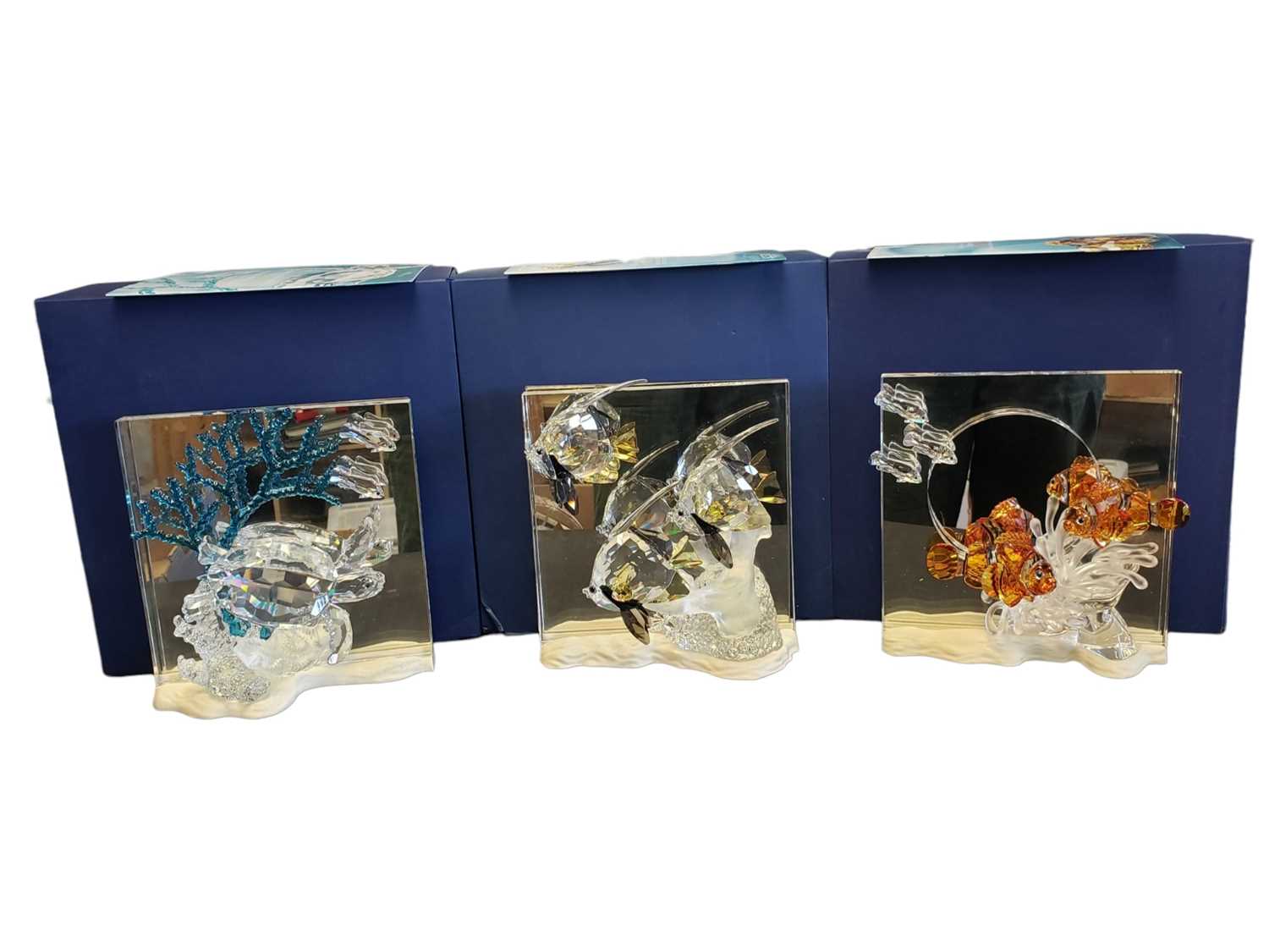 Lot 94 - SWAROVSKI - 21ST CENTURY WONDERS OF THE SEA SET OF THREE CRYSTAL GLASS FIGURES