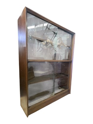 Lot 633 - HERBERT GIBBS FURNITURE - MID CENTURY TEAK SLIDING BOOKCASE CABINET