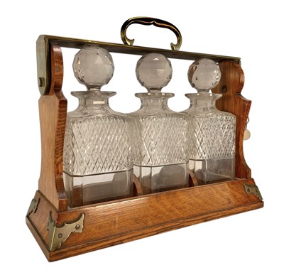 Lot 72 - EARLY 20TH CENTURY BETJEMANNS PATENTED OAK & METAL TANTALUS