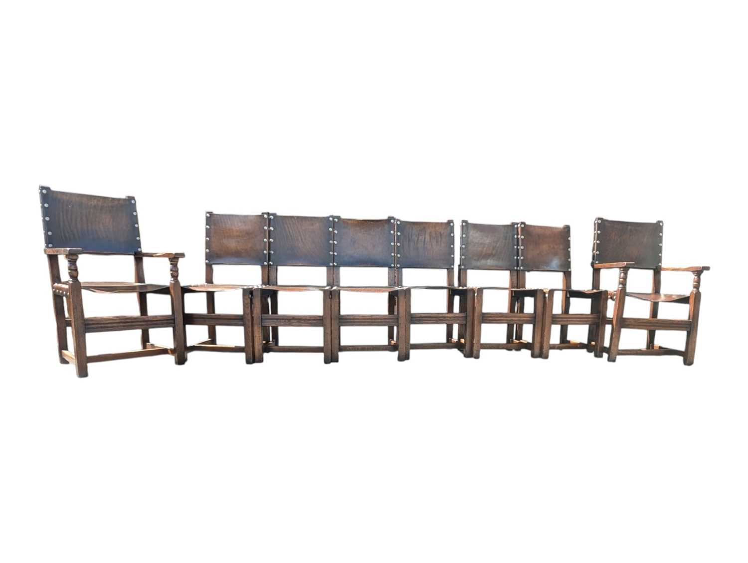 Lot 742 - EIGHT CROMWELLIAN STYLE OAK & HIDE DINING CHAIRS
