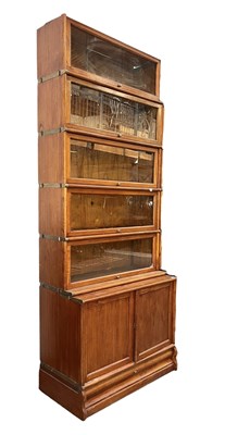 Lot 338 - GLOBE WERNICKE - 20TH CENTURY OAK FIVE TIER & CUPBOARD BASE STACKING BOOKCASE