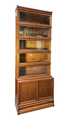 Lot 339 - GLOBE WERNICKE - 20TH CENTURY OAK FIVE TIER & CUPBOARD BASE STACKING BOOKCASE