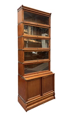 Lot 340 - GLOBE WERNICKE - 20TH CENTURY OAK FIVE TIER & CUPBOARD BASE STACKING BOOKCASE