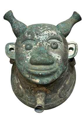 Lot 111 - CHINESE SHANG DYNASTY STYLE BRONZE 'HE' WINE VESSEL WITH HUMAN FACE 青铜人面盉酒壶