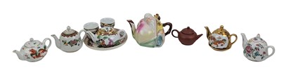 Lot 123 - 20TH CENTURY CHINESE CANTON FAMILLE ROSE TEA SET 粉彩茶壶一组和款落“荊溪惠孟臣制”紫砂壺