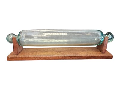 Lot 175 - 19TH CENTURY NAILSEA HAND-BLOWN GLASS ROLLING PIN ON STAND
