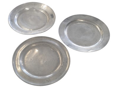Lot 464 - THREE 18TH CENTURY PEWTER CHARGER PLATES