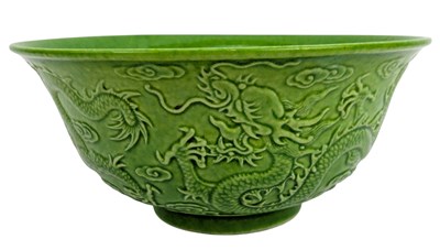Lot 75 - CHINESE GREEN GLAZED RELIEF 'DRAGON & CLOUD' BOWL 乾隆款 绿釉浮雕云龙纹盌