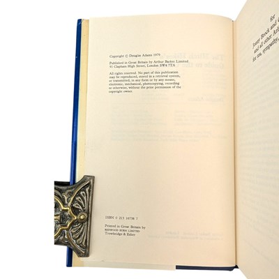 Lot 56 - ADAMS, DOUGLAS - 1979 THE HITCH HIKER'S GUIDE TO THE GALAXY - FIRST EDITION