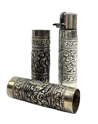 Lot 87 - THREE 20TH CENTURY INDIAN SILVER LIGHTER HOLDERS
