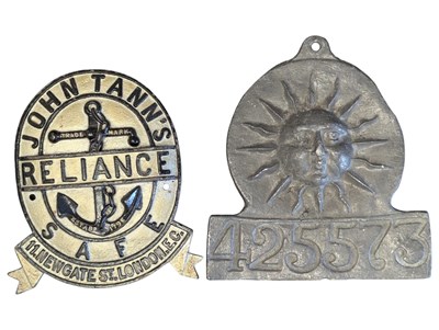 Lot 314 - JOHN TANN'S SAFE METAL PLAQUE TOGETHER WITH LEAD SUN PLAQUE
