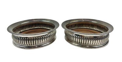 Lot 53 - PAIR OF GEORGE III HALLMARKED SILVER WINE / CHAMPAGNE COASTERS