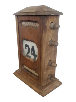 Lot 324 - 20TH CENTURY PERPETUAL WOODEN/MAGOGANY DESK TOP CALANDAR