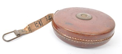 Lot 238 - SET OF TWO 1960S LEATHER CASED SURVEYOR TAPE MEASURES