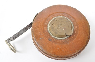Lot 238 - SET OF TWO 1960S LEATHER CASED SURVEYOR TAPE MEASURES