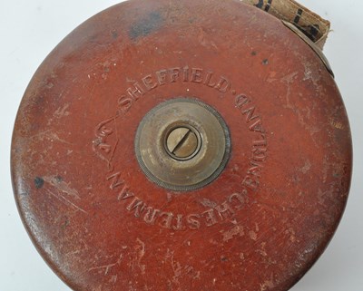 Lot 238 - SET OF TWO 1960S LEATHER CASED SURVEYOR TAPE MEASURES