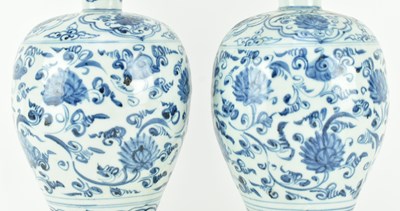 Lot 28 - PAIR OF MING BLUE AND WHITE MEIPING VASES 明 青花缠枝牡丹梅瓶一对