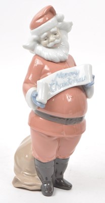 Lot 35 - NAO - LLADRO - TWO CONTEMPORARY PORCELAIN CHRISTMAS FIGURINES