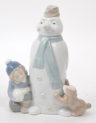 Lot 35 - NAO - LLADRO - TWO CONTEMPORARY PORCELAIN CHRISTMAS FIGURINES