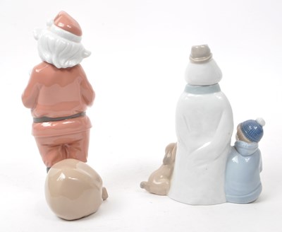Lot 35 - NAO - LLADRO - TWO CONTEMPORARY PORCELAIN CHRISTMAS FIGURINES