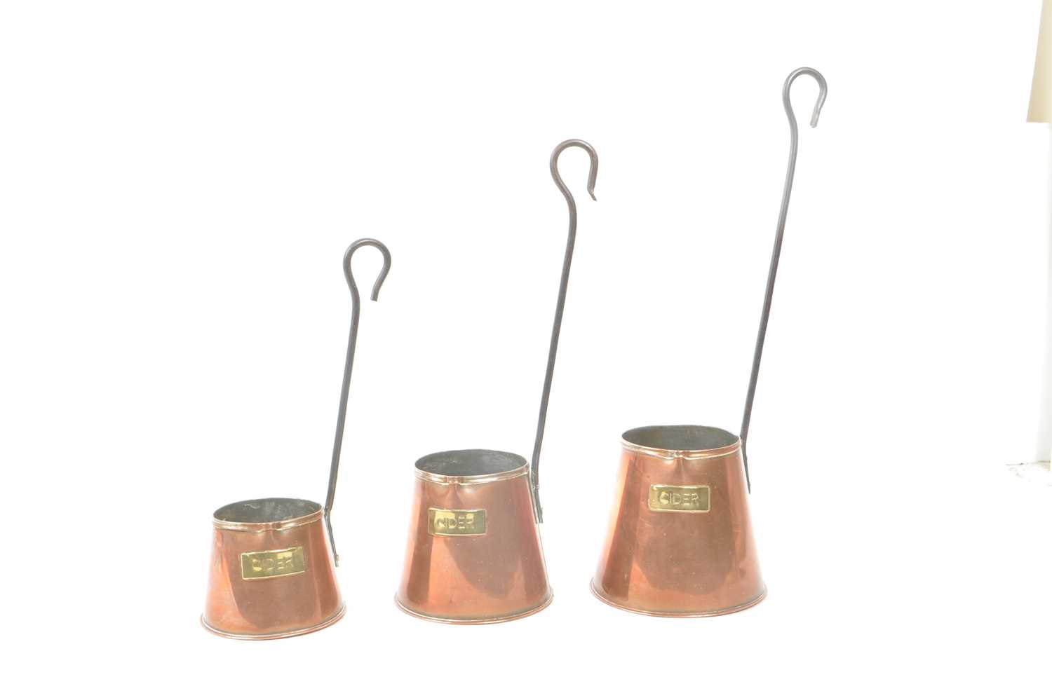 Lot 253 - SET OF THREE GRADUATING CIDER MEASURES