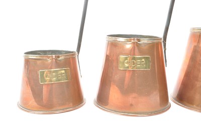 Lot 253 - SET OF THREE GRADUATING CIDER MEASURES