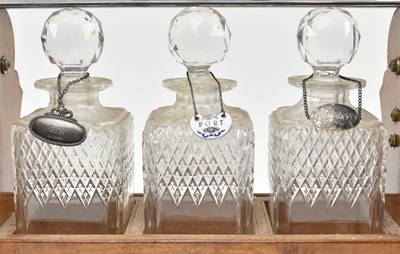 Lot 156 - 19TH CENTURY SILVER PLATED & OAK THREE CUT GLASS DECANTERS TANTULUS