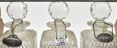 Lot 156 - 19TH CENTURY SILVER PLATED & OAK THREE CUT GLASS DECANTERS TANTULUS