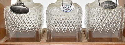 Lot 156 - 19TH CENTURY SILVER PLATED & OAK THREE CUT GLASS DECANTERS TANTULUS